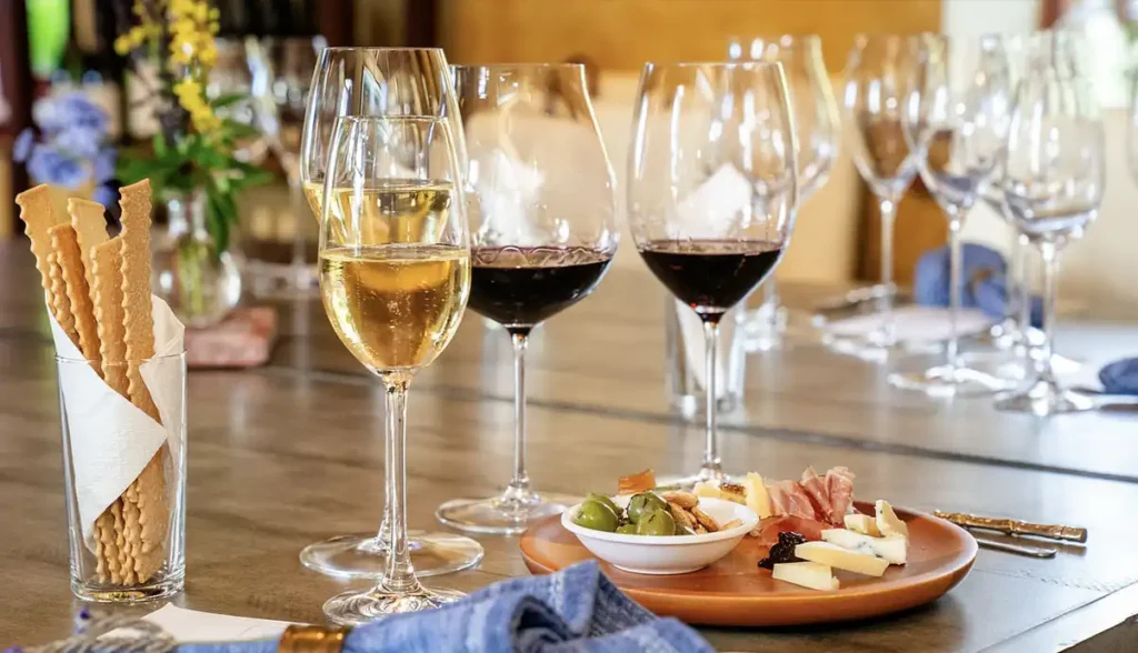 Wine glasses and small bites set for The Tasting Table