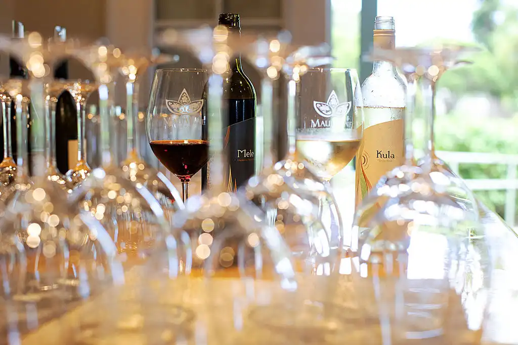 Rose Ranch wines and wine glasses on a table