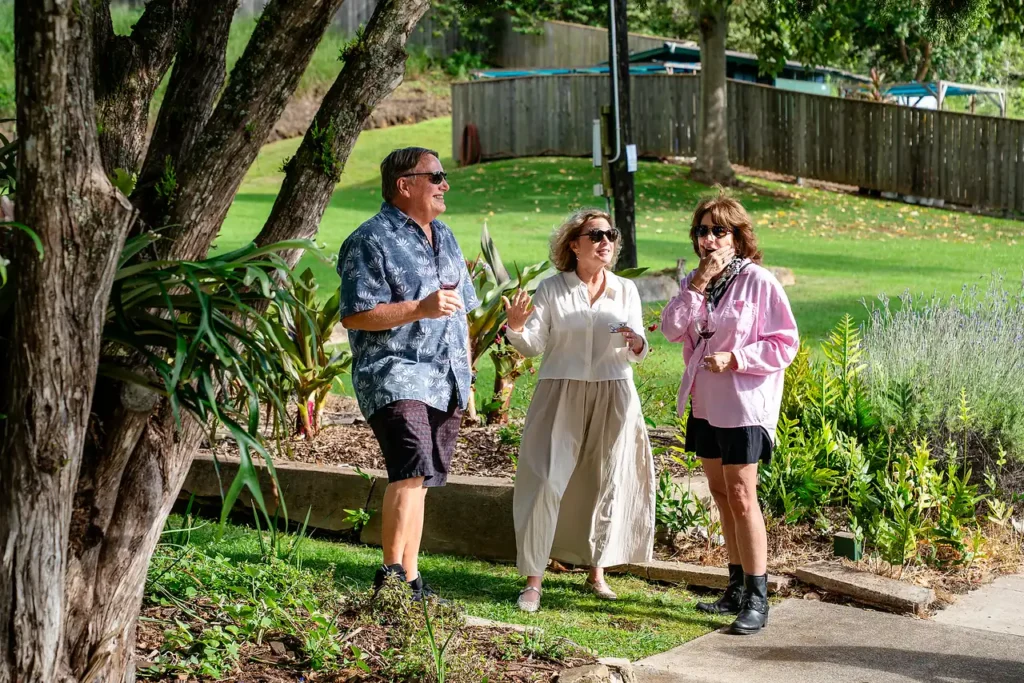 Guests strolling the garden path at a wine club event