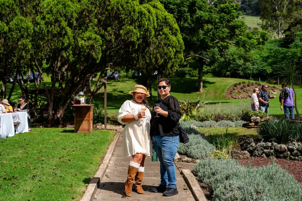 Guests walking a garden path at the historic estate