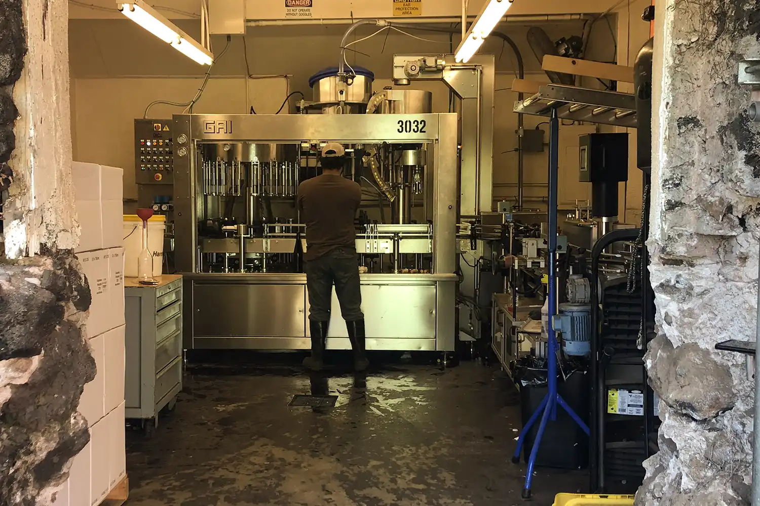 Winemaker at the bottling line inside the winery