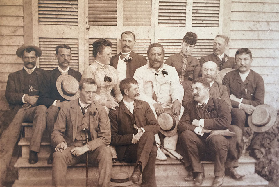 Historic group photo of the Poker Club on the steps at Rose Ranch